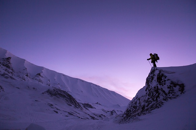 Mountain climbers on a rocky peak, representing adventure travel