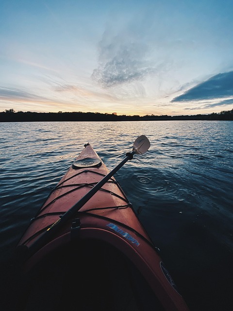 Kayaking through calm waters, symbolizing water sports adventure
